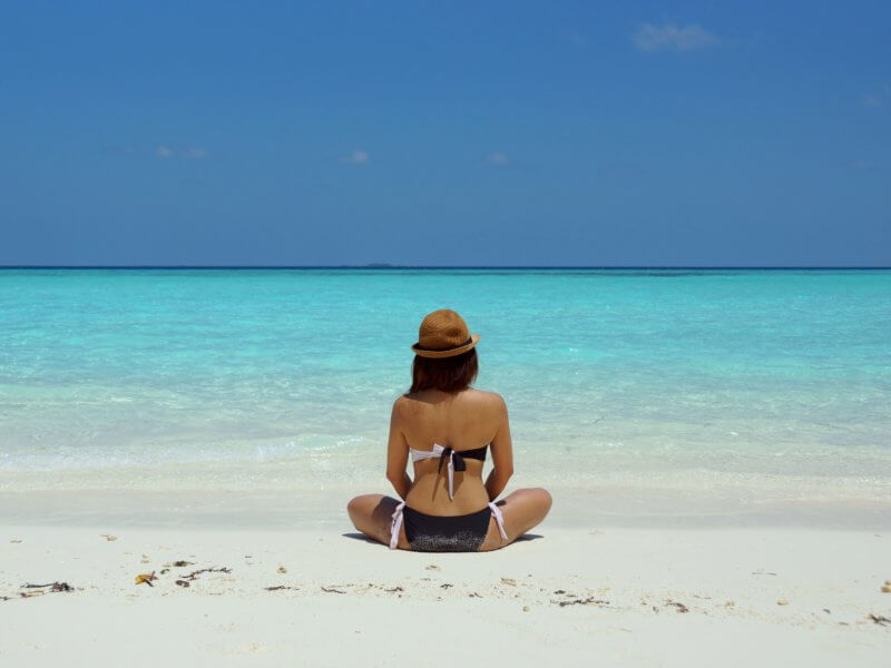 Woman sitting on the beach