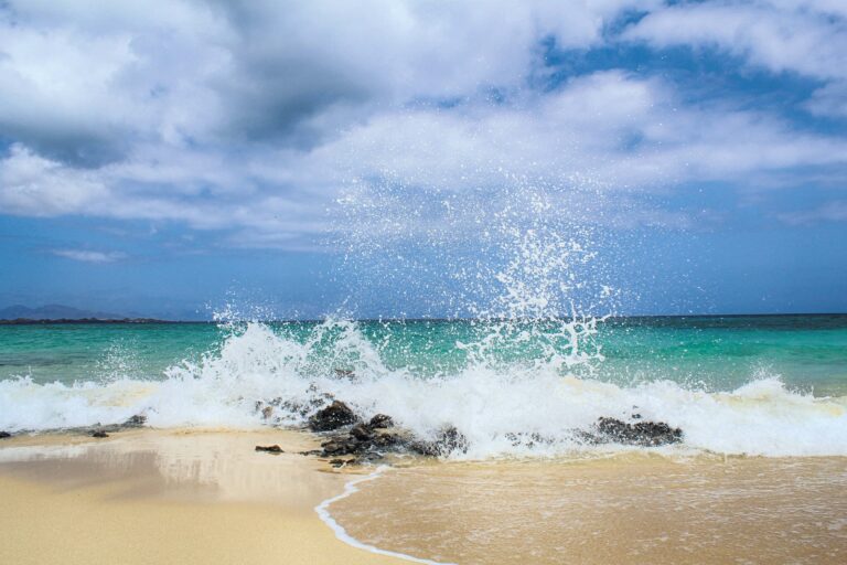 Ocean splashing on the beach: Things You Absolutely Should Not Do In Cabo San Lucas