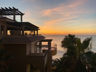 Cabo San Lucas Mexico Everything You Need to Know: Resort and Ocean at sunset