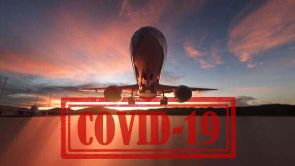 plane taking off at sunset with covid 19