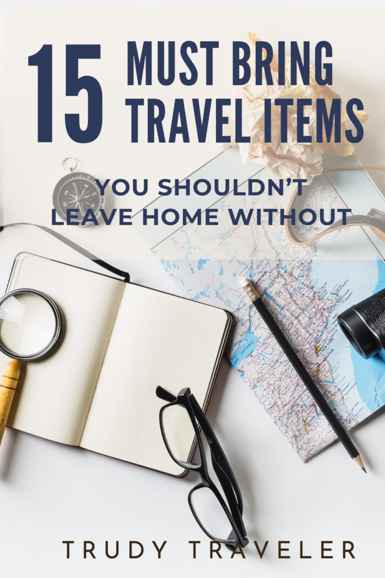 Best travel accessories: Map, notebook, map, glasses on a desk