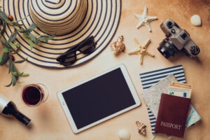 hat, sunglasses, passport, tablet, camera