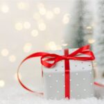 White gift box with red bow