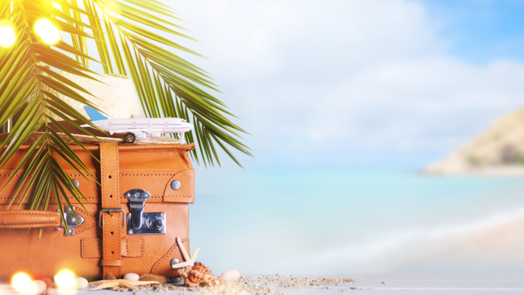 shop travel store now luggage and toy plane on the beach