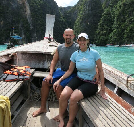 Trudy Traveler in a long boat in thailand