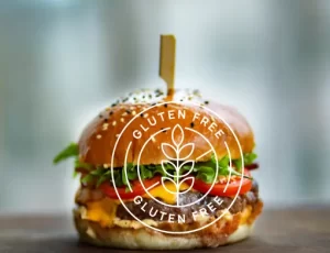 Celiac Travel Guide: 12 Expert Tips for Traveling Gluten Free- hamburger with gluten-free over it