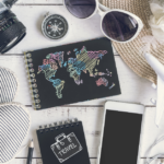 Travel Gear I Never Fly Without: sunglasses, compass, phone, camera, phone, toy plane, hat