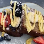 best of sonoma gluten-free: banana bread covered in creme fresche, blueberries, bananas and strawberries