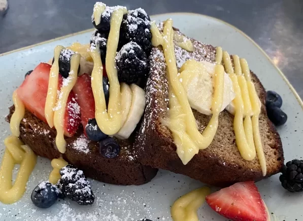 best of sonoma gluten-free: banana bread covered in creme fresche, blueberries, bananas and strawberries
