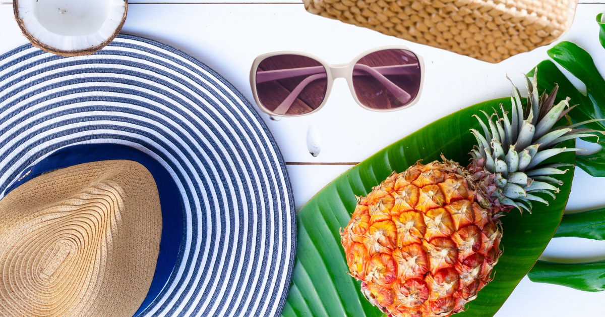 15 Cute Vacation Outfits For a Stylish Getaway: hat sunglasses, bag and pineapple