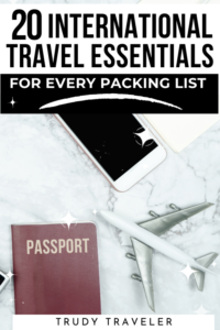 20 International Travel Essentials for Every Packing List: phone, passport, and toy plane